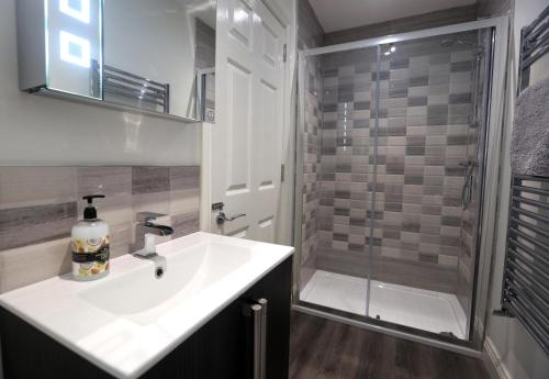 a bathroom with a sink and a shower at Church View in York
