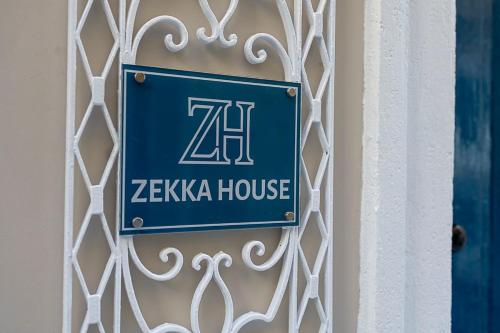 a blue sign on the side of a building at Zekka House in Valletta