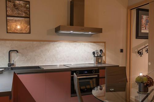a kitchen with a sink and a stove top oven at Zekka House in Valletta