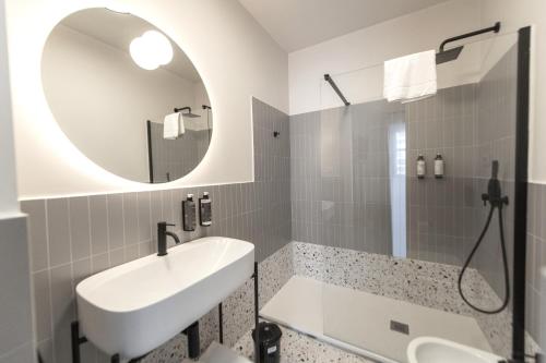 a bathroom with a sink and a mirror at Montebello Comfort in Ancona