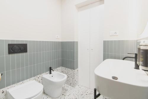 a bathroom with a sink and a toilet at Montebello Comfort in Ancona