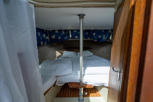 a small bedroom with a bed in a small room at Le Village de la Champagne - Slowmoov in Bar-sur-Aube