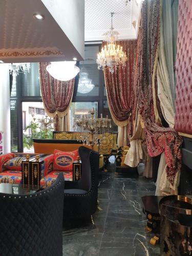 a dressing room with furniture and a chandelier at Luxury Villa with Pool & Garden in Casablanca in Tamaris