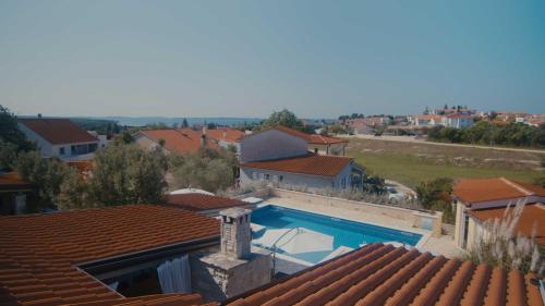 an aerial view of a house with a swimming pool at Villa Kalista Istriana for 10 people with private pool & sea view in Gajana