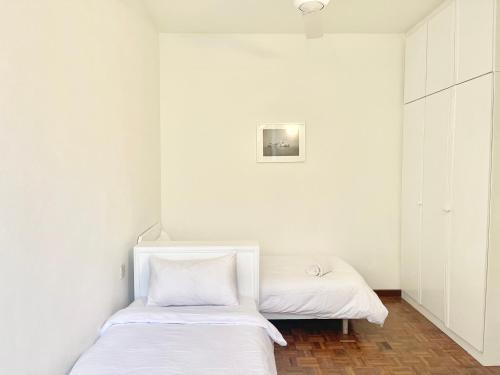 Ένα ή περισσότερα κρεβάτια σε δωμάτιο στο My Cozy Nest - Near Beach