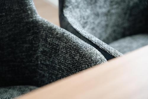 a close up of a gray suit with a tie at Stadthaus Rosengartenschlucht in Imst