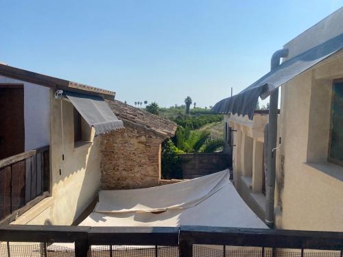 a view from the balcony of a building with a sheet at La Terreta hotel casa rural in El Brosquil