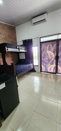 an empty room with a bed and a window at Balu Accommodation in Ciudad Cortés