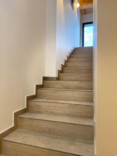 a staircase in a house with wooden floors at Citrus Holidays House in Catania
