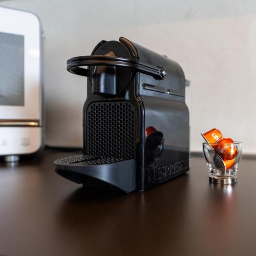 a toaster sitting on top of a wooden table at Antica Corte Lugo in Lugo