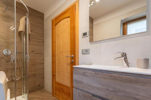 a bathroom with a sink and a shower at Casa Lucia in Mezzano