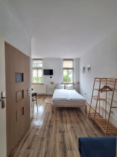 Postel nebo postele na pokoji v ubytování Roland Apartamenty