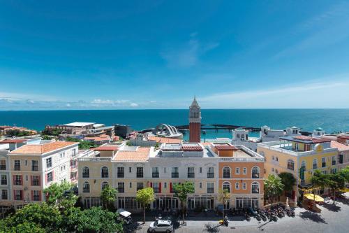 an aerial view of a city with a clock tower at Capella Apartment Fireworks and Ocean View- Hillside Phu Quoc in Phu Quoc