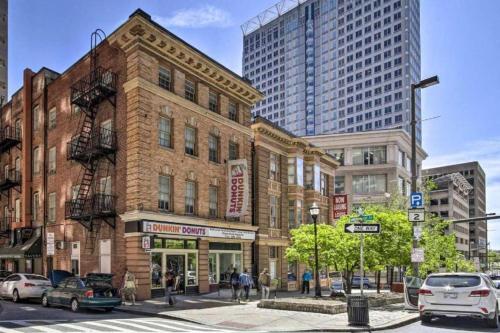 a building on the corner of a city street with buildings at Harbor furnished apartments free indoor parking in Baltimore