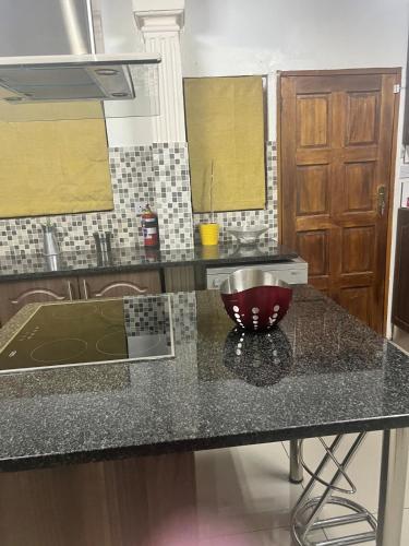 a kitchen with a counter with a bowl on it at La Mia casa in Gaborone