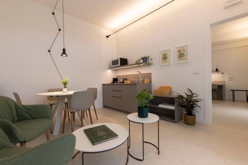 a living room with a couch and a table at Grow Green in Caponago