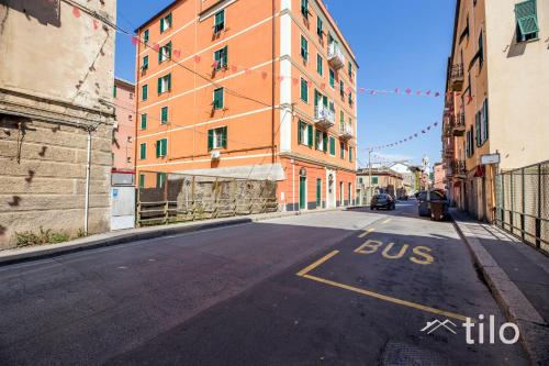 an empty street with a building with the words bus at Airport 8 Minutes, 2BR, Terrace, By Tilo in Genova