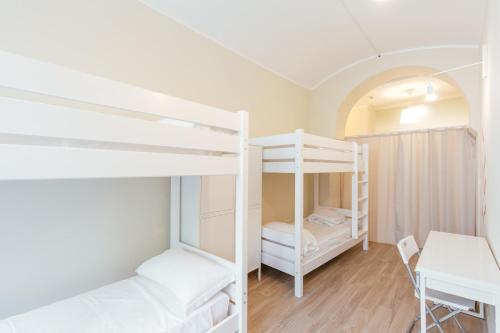 Ένα ή περισσότερα κρεβάτια σε δωμάτιο στο Tomato Backpackers