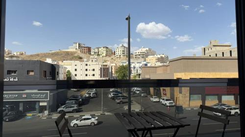 a view from a window of a city street with cars at Le Reve Hotel إحدى فنادق مجموعة لوريف By Le Reve Company in Taif