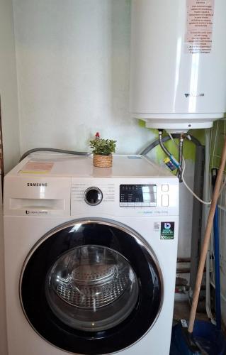 a washing machine with a plant on top of it at Casco historico La Serena in La Serena