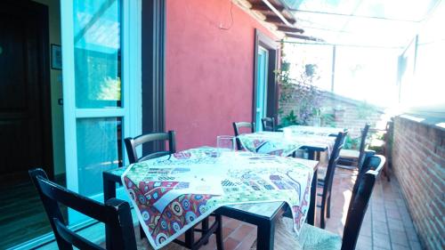 a row of tables and chairs on a patio at Rifugio Nel Bosco in Rieti