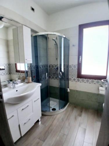 a bathroom with a shower and a sink at B&b Il Giardinetto in Selargius