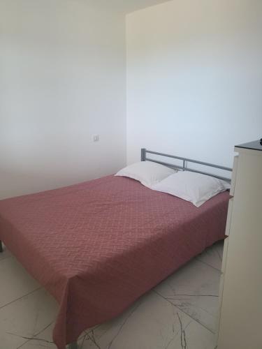 Ένα ή περισσότερα κρεβάτια σε δωμάτιο στο Solenzara T2 rez de villa, vue mer, proximité plage et village