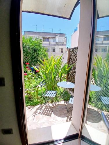 a view of a patio from a window at B&b Il Giardinetto in Selargius