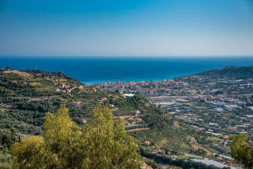 a view of a city from a mountain at Fra Cielo e Mare - Private parking & Wi-Fi in Castellaro