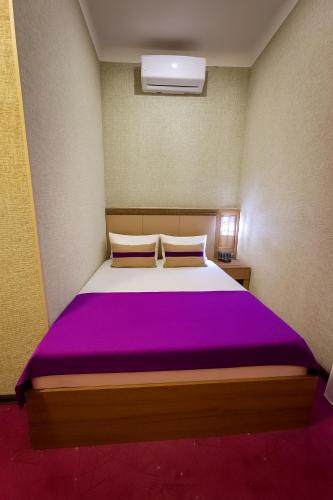 Postel nebo postele na pokoji v ubytování City Center Hotel