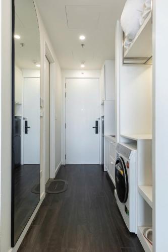 a laundry room with a washer and dryer at Capella Apartment Fireworks and Ocean View- Hillside Phu Quoc in Phu Quoc