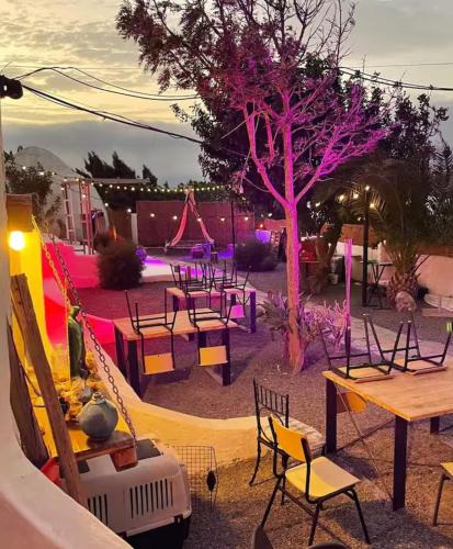 a playground with tables and chairs and a slide at Finca Oaxaca - Casa Iguana in Agaete