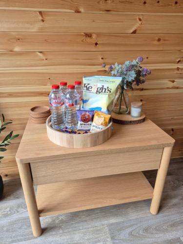 a table with a tray of food and drinks on it at Culdaff Estate Glamping in Culdaff