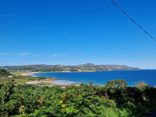a view of a beach and the ocean at Culdaff Estate Glamping in Culdaff
