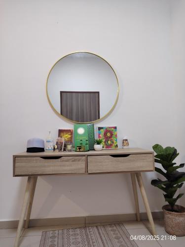 a dressing table with a mirror on top of it at Teratak Asyakira in Bedung