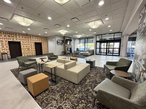 a lobby with couches and chairs in a building at Best Western Plus Downtown Tacoma in Tacoma