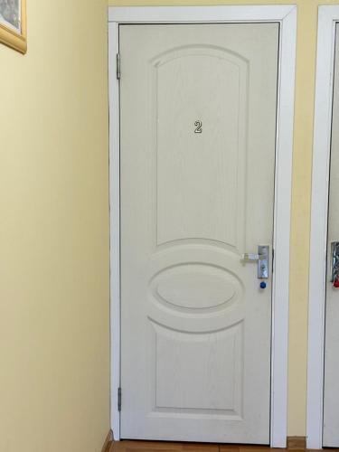 a white door with the number on it at Konstantin House in Sarpi