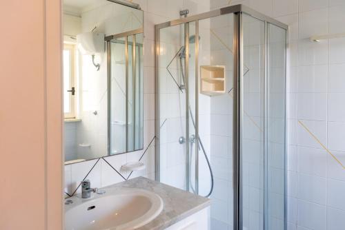 a bathroom with a sink and a shower at Hotel Pietra Verde in Otranto