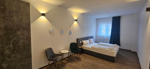 Una cama o camas en una habitación de My Wolly Hostel Füssen