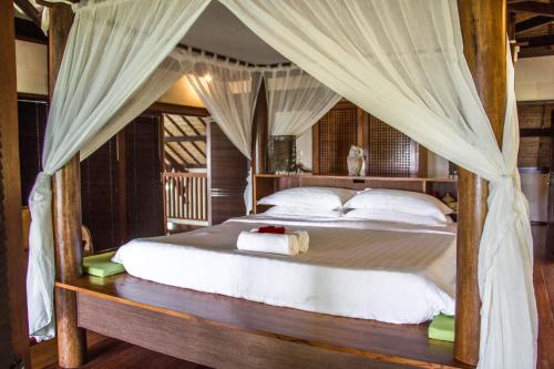 Кровать или кровати в номере Luxurious Private Holiday Villa at Tip of Borneo