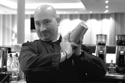 a man holding a cell phone in his hands at Waldhotel Stuttgart in Stuttgart