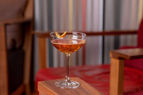 a drink in a glass sitting on a table at Waldhotel Stuttgart in Stuttgart