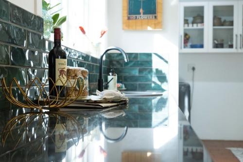a bottle of wine sitting on a counter in a kitchen at Stanford River Retreat in Stanford