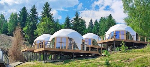 a row of luxury yurt homes on a hill at Chalet Fomich in Bukovel
