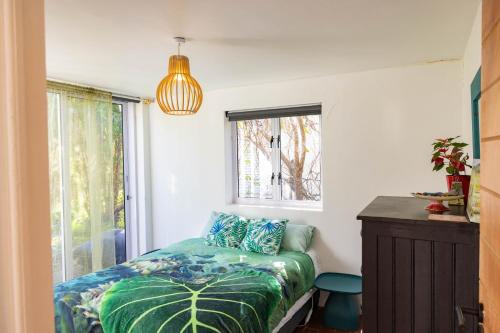 a bedroom with a bed and a window at Stanford River Retreat in Stanford