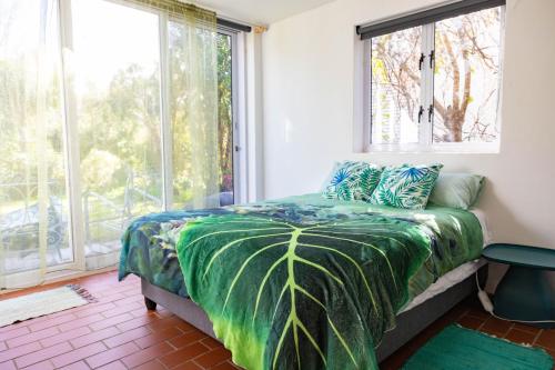 a bedroom with a bed with a large window at Stanford River Retreat in Stanford