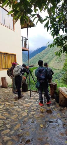 a group of people standing outside of a building at Ecoterra Inka Lodge in Santa Ana