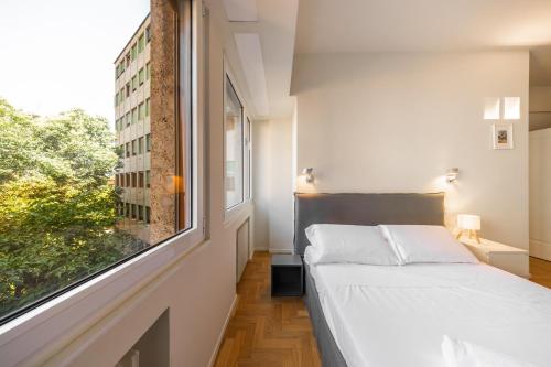 Ένα ή περισσότερα κρεβάτια σε δωμάτιο στο Art Luxury apartment in the heart of Bologna