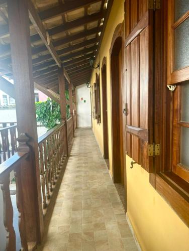 an empty hallway of a building with a hallway at Viva Brasil Pousada in Paraty