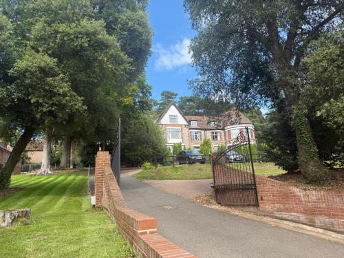 a brick wall with a gate in a yard at Cromer Getaway luxury apartment in Cromer